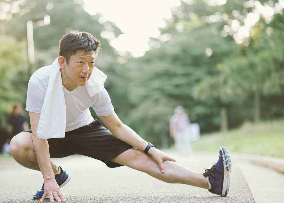 man stretching before going for a run