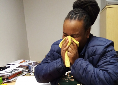 Woman sneezing due to allergies