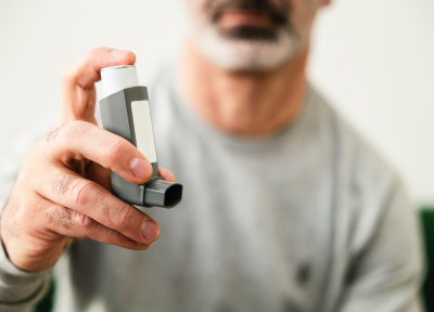man holding inhaler